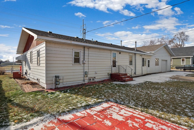 rear view of property with a lawn and a patio area