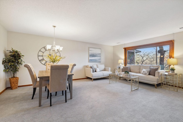 carpeted living room featuring a chandelier and a textured ceiling