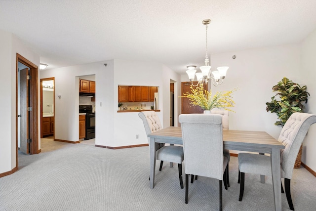 carpeted dining space featuring a chandelier