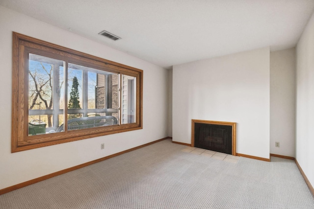 unfurnished living room with light carpet