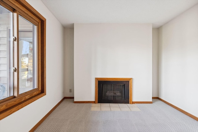 unfurnished living room featuring light colored carpet