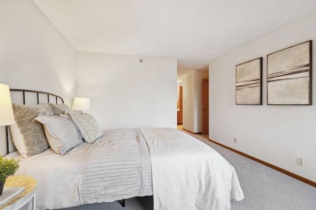 bedroom with light colored carpet