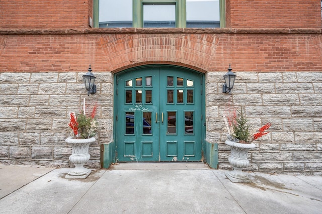 view of exterior entry featuring french doors