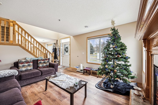 living room featuring hardwood / wood-style floors and a textured ceiling