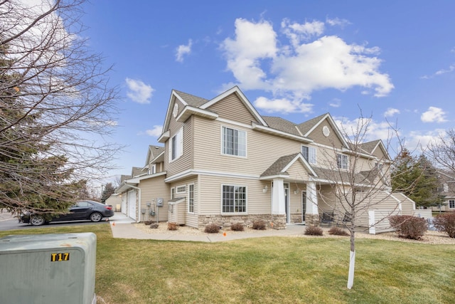 view of front facade with a garage and a front yard