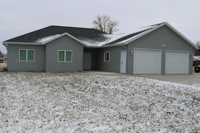 ranch-style house featuring a garage