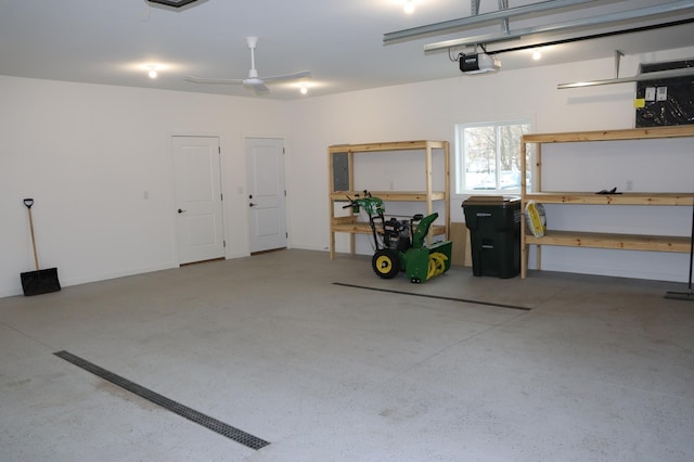 garage with a garage door opener and ceiling fan