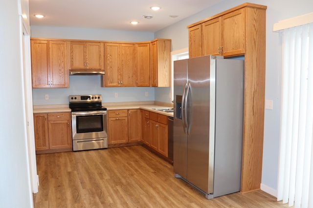 kitchen featuring light hardwood / wood-style floors, sink, and stainless steel appliances