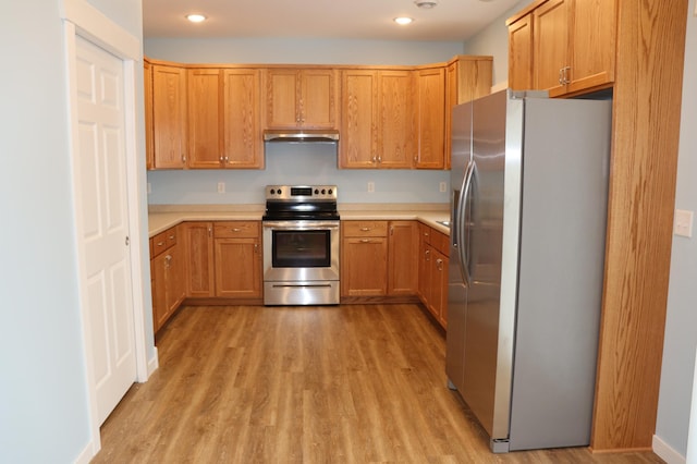 kitchen featuring light hardwood / wood-style floors and appliances with stainless steel finishes