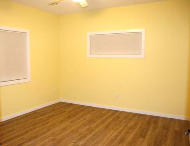 unfurnished room with wood-type flooring and ceiling fan