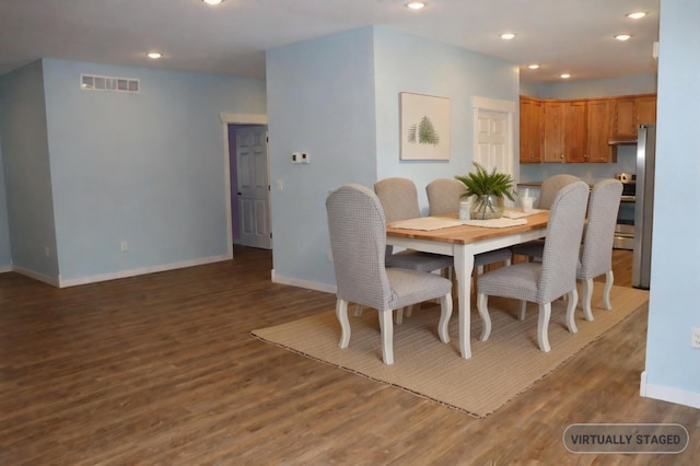 dining space featuring wood-type flooring