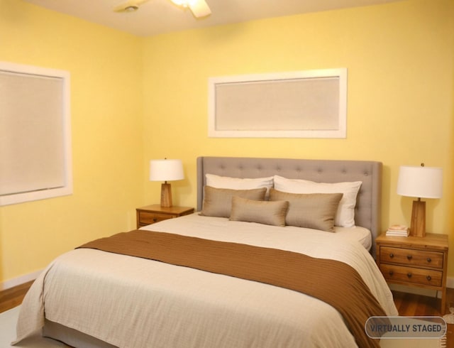 bedroom featuring wood-type flooring and ceiling fan