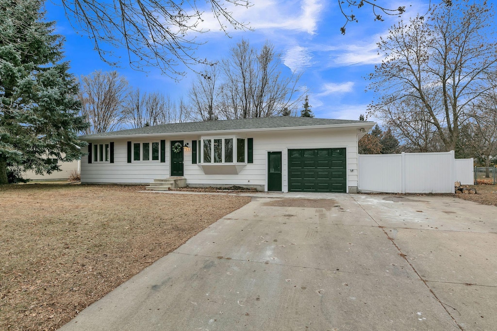 ranch-style home with a garage