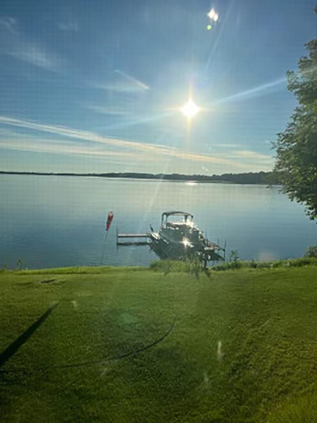 19466 Peninsula Trl, Clitherall Twp, MN 56515 - dock area with boat lift and a water view