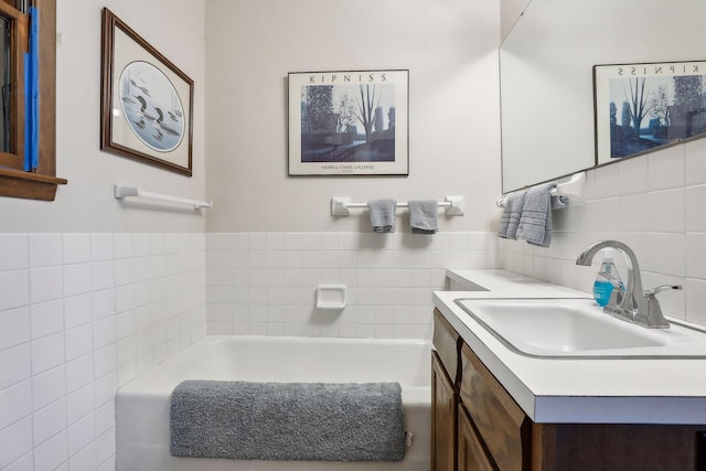 bathroom with vanity and a bathtub