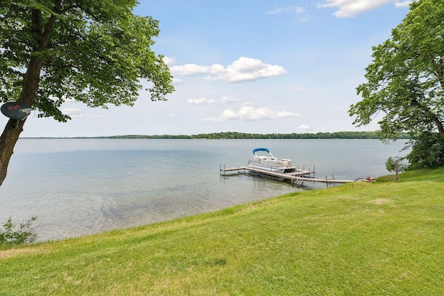 dock area featuring a water view and a yard