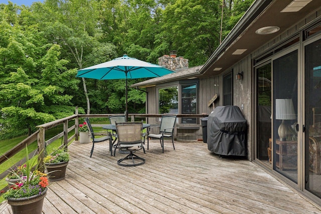 wooden deck featuring grilling area