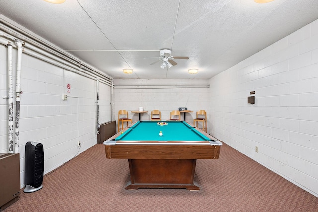 recreation room featuring dark colored carpet, ceiling fan, a textured ceiling, and billiards