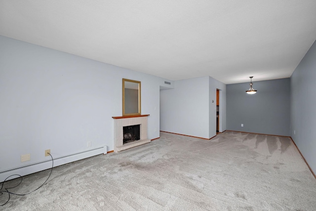 unfurnished living room featuring carpet floors and a baseboard heating unit