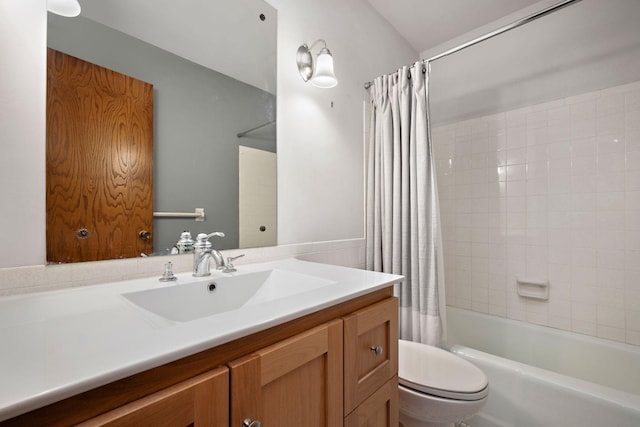 full bathroom featuring shower / bath combination with curtain, toilet, and vanity