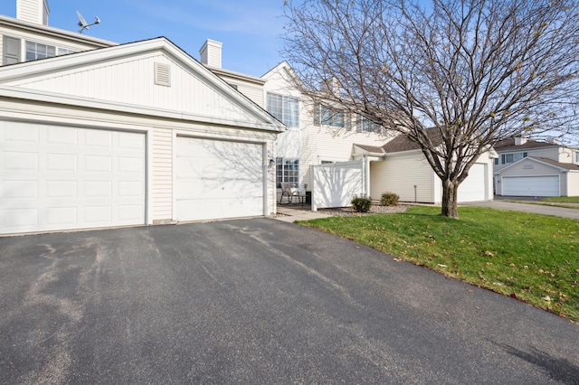 view of front property with a front yard and a garage