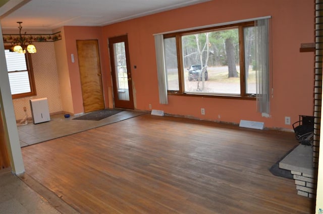 interior space with hardwood / wood-style flooring and a notable chandelier