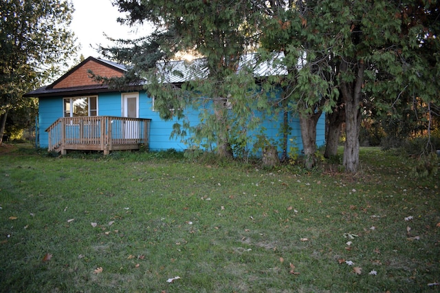 view of yard featuring a wooden deck