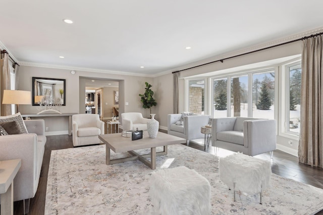 living room featuring hardwood / wood-style flooring and ornamental molding