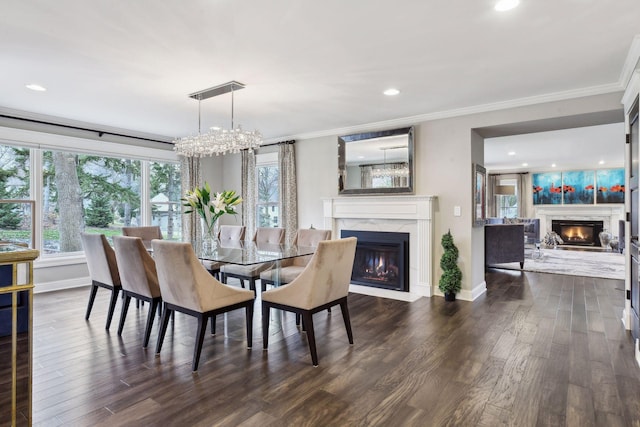 dining space featuring crown molding, a high end fireplace, and dark hardwood / wood-style flooring