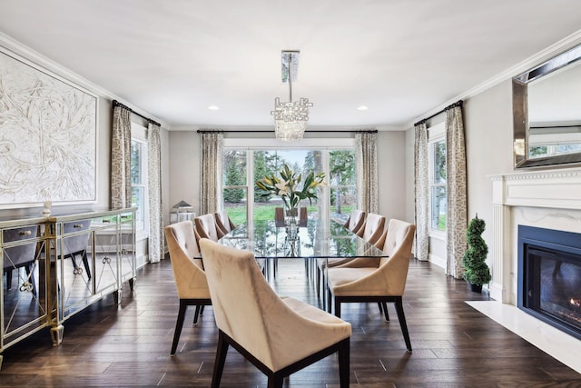 dining room featuring a fireplace, dark wood-type flooring, and ornamental molding