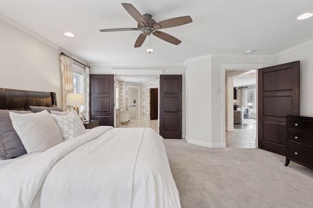 carpeted bedroom with crown molding, ceiling fan, and ensuite bathroom