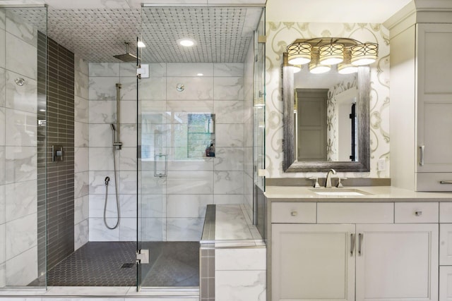 bathroom featuring vanity and a shower with shower door