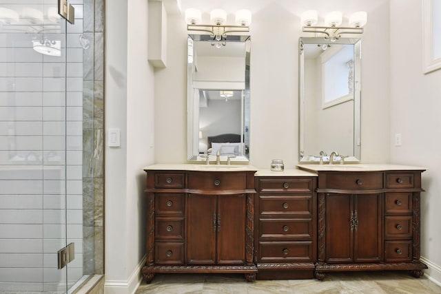 bathroom featuring vanity, a notable chandelier, and a shower with shower door