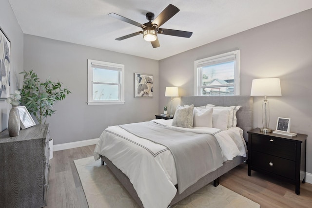 bedroom featuring ceiling fan and light hardwood / wood-style floors