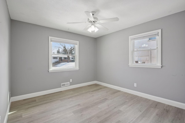 unfurnished room with ceiling fan and light hardwood / wood-style flooring