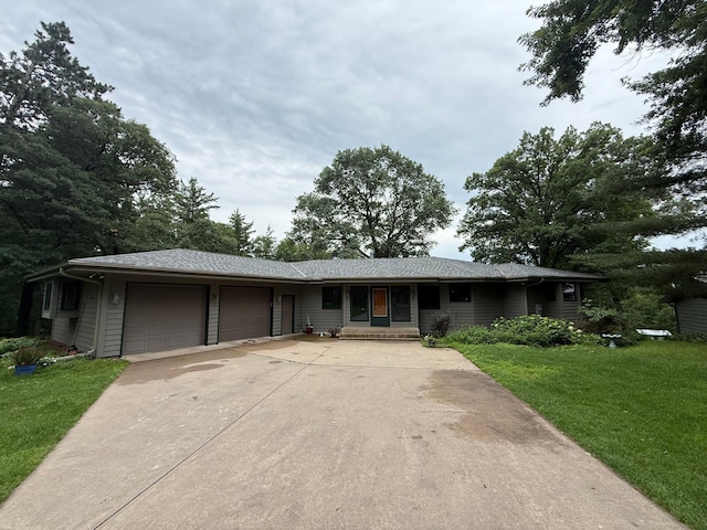 3929 County Road 17, Pequot Lakes, MN 56472 - ranch-style house with an attached garage, a front yard, and concrete driveway
