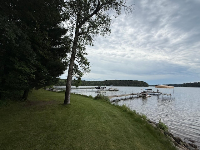 3929 County Road 17, Pequot Lakes, MN 56472 - dock with a water view and a lawn