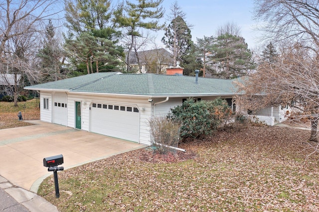 view of side of home with a garage