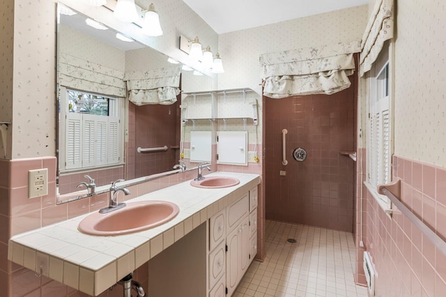 bathroom featuring tile patterned floors, vanity, and tile walls