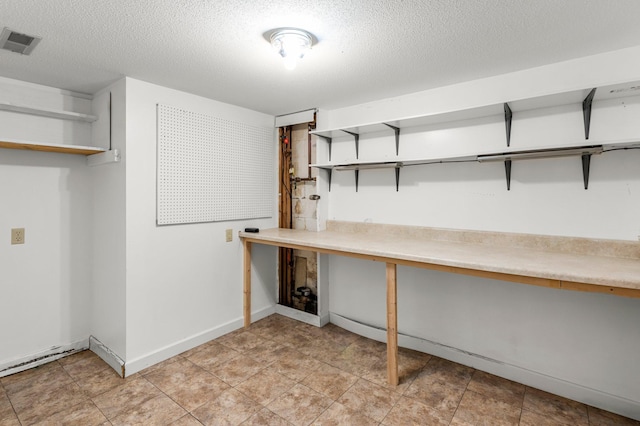 basement with a textured ceiling