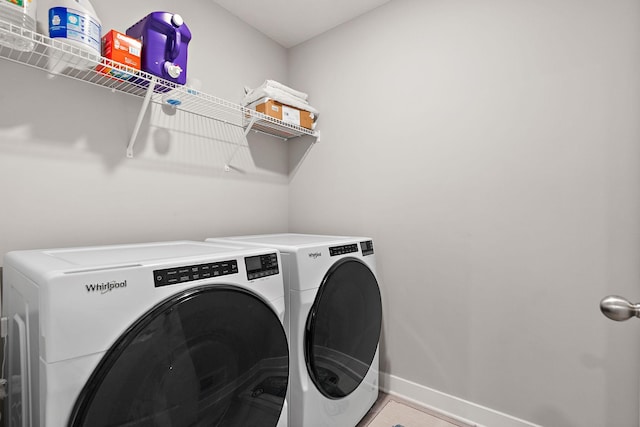 clothes washing area featuring independent washer and dryer