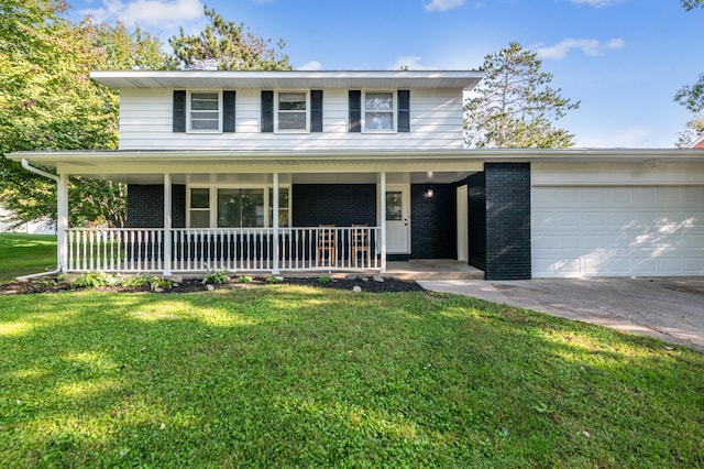 traditional home with a front yard, covered porch, brick siding, and an attached garage