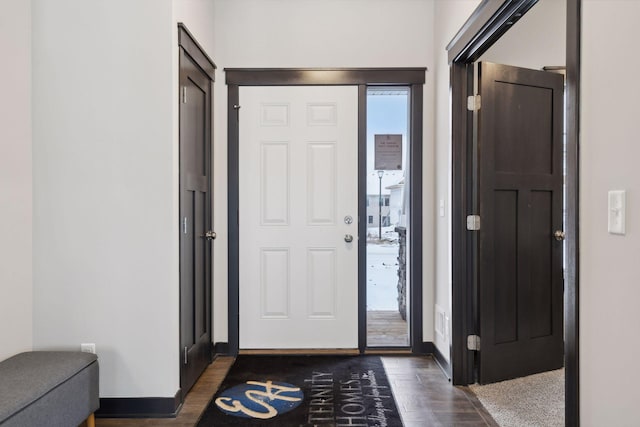 foyer with dark hardwood / wood-style floors