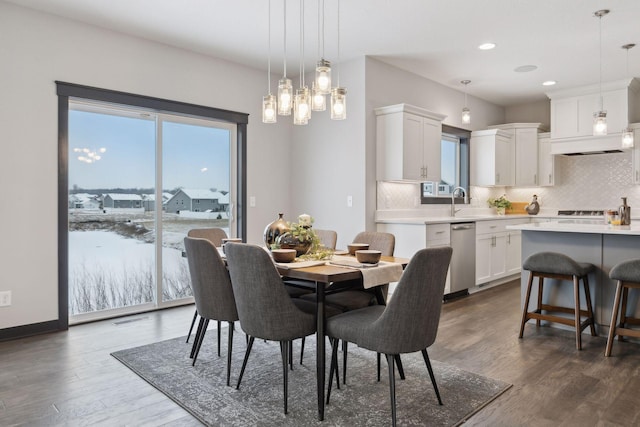 dining area featuring dark wood-type flooring