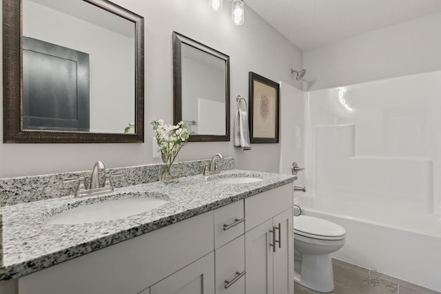 full bathroom featuring vanity,  shower combination, toilet, and tile patterned flooring