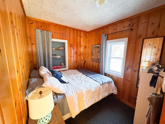 bedroom with wood walls