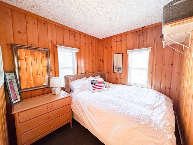 bedroom with wood walls