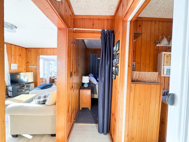 hallway with wooden walls