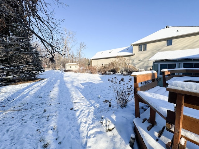 view of yard layered in snow