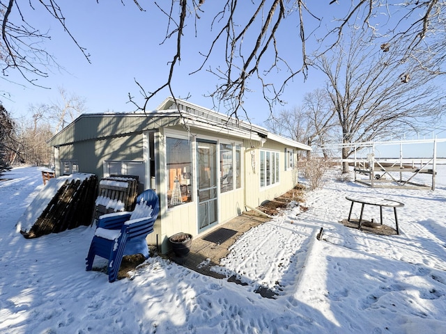 view of snow covered house